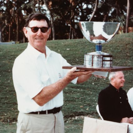 Lew Oehmig holding a trophy