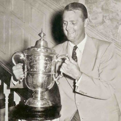 Mack Brothers Jr. holding a trophy