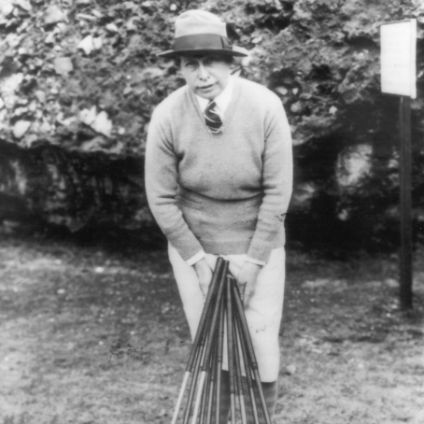 Photo of Margarite Gaut holding several golf clubs