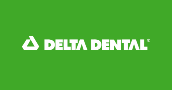 Delta Dental logo on green background.